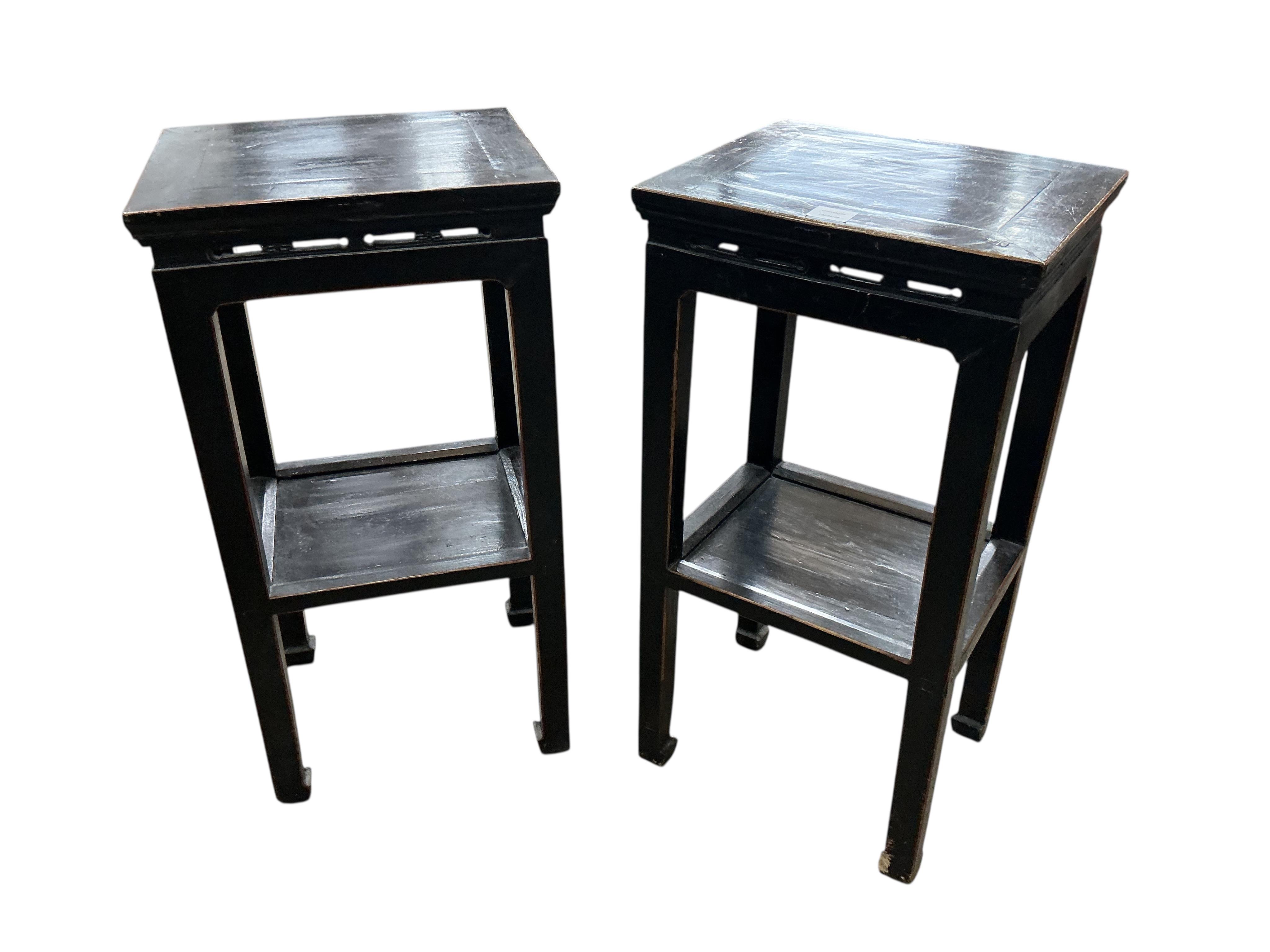 A pair of Chinese lacquer two tier tables, width 41cm, depth 34cm, height 79cm, Provenance: The late Kenneth Turner (1936-2025), celebrity florist, designer and perfume retailer, he received the Royal Warrant from the Pr